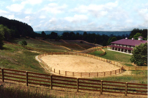 Quality pressure treated wooden ranch fences designed by Proulx Fencing of Metamora, Michigan.
